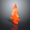 Orange Arrow Shaped Wooden Stone Decor With Gray Background And Reflective Surface
