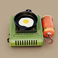 Portable Green Gas Stove with Frying Pan and Fried Egg for Home Kitchen Cooking