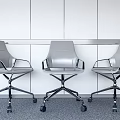 Modern Gray Office Chairs With Swivel Wheels Metal Base White Walls Gray Carpet