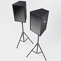 Two Black Speakers Mounted On Tripod Stands For Event Sound Setup