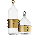 Tall and Short Transparent Glass Bottles with Golden Metal Rings Rivets and Top Ring Handle