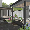 Modern Garden Design With Outdoor Sofas Coffee Table Colorful Flowers And Stone Pavement