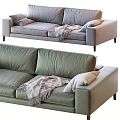 Modern Green And Light Gray Two Seater Sofa With Pillows And Blanket
