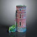 Ruined Red Brick Tower With Partial Wall Collapse And Green Plants At Base