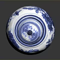 Carved Blue And White Vase Sculpture With Intricate Floral Patterns And Decorative Details