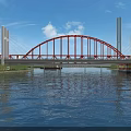 Red Arch Bridge With White Towers Spanning Calm Water Under Blue Sky And Clouds