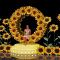 Floral Installation With Circular Sunflower Arrangement Platform And Woman In Pink Dress On Black Background
