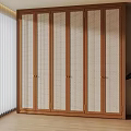 Modern Wooden Wardrobe With Woven Panel Doors In Bright Interior Space With Plant