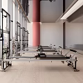 Modern Bright Fitness Studio With Pilates Reformers Large Windows And Red Columns
