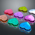 Colorful Heart Shaped Objects with Shiny Surfaces in Multiple Colors Arranged on Dark Background