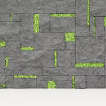 Black Slate Tiled Feature Wall With Green Irregular Squares And Glowing Strips