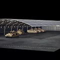 Two Sand Colored Military Tanks With Tracks Parked In Industrial Warehouse
