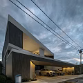 Modern Detached Villa With Geometric Exterior Large Windows And Cloudy Sky