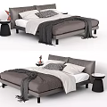 Grey Upholstered Double Bed With White Sheets Patterned Pillows Grey Throw And Side Tables