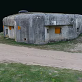 Old Concrete Bunker Structure With Grass Covered Roof Yellow Door And Round Markers