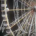 Ferris Wheel Amusement Equipment With White Hub Metal Frame LED Lights And Passenger Cabins