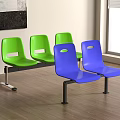 A Row of Green and Blue Public Chairs with Metal Legs in Indoor Waiting Area