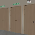 Three Wooden Doors With Green Emergency Exit Signs In Indoor Environment