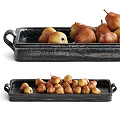 Fresh Ripe Pears Arranged on Two Black Ceramic Trays with Handles