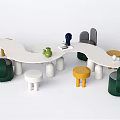 White Wavy Kids Table With Colorful Chairs Stools And Toys Teapot Little Statues On Top