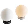 Modern Minimalist Table Lamp With Cream Colored Spherical Lampshade And Black Base