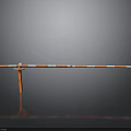 Orange Post Red White Striped Barrier With Gray Background And Floor Reflection