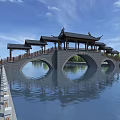 Traditional Chinese Arched Bridge Featuring Pavilions Over Water With Green Trees And Blue Sky