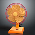 Portable Electric Fan With Red Frame Yellow Blades And Orange Base For Home Use