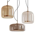 Modern Glass Pendant Lights with Transparent and Light Brown Shades and Metal Accents