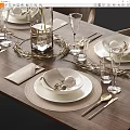 Elegant Dinnerware Set With White Plates Beige Napkins Gold Accents And Glassware For Table Setting