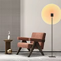 Modern Single Sofa With Brown Upholstery Wooden Frame Small Side Table Vase And Floor Lamp