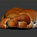 Freshly Baked Braided Bread With Shiny Golden Brown Crust And Soft Texture