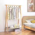 Wooden Clothes Rack With Hanging Dresses In Bedroom Setting Lower Shelf Folded Clothes Storage Box