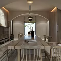 Bright Hotel Public Lounge Area With Arched Doorway Beige Walls Plant Armchair And Fireplace