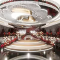 Luxurious Banquet Hall With Red Decorations Crystal Chandeliers Round Tables Fresh Flowers And Staircase Stage