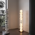 Modern Stacked Marble Floor Lamp With Spherical Top Near Window And Plant