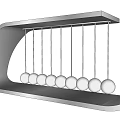 Decorative Ornament Set with Silver Metal Frame and Multiple Balls Newton's Cradle Design