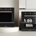 Samsung Kitchen Appliances Oven and Dishwasher on White Countertop with Light Cabinets