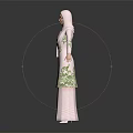 Woman Wearing Traditional Pink Dress With Green Embroidery And Hijab Standing