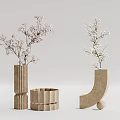 Various Shaped Textured Stone Vases with Pink White Floral Branches for Interior Decor