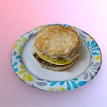 Delicious Chicken Biscuit Sandwich on Colorful Paper Plate with Egg Layer