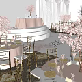 Elegant Banquet Hall Setup with Cherry Blossom Trees Round Tables and Decorative Stage