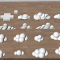 White Cloud Shaped Objects Arranged Neatly On Wooden Floor Surface 3d model