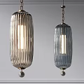 Modern Ribbed Glass Pendant Lights With Clear And Blue Shades Hanging From Chains