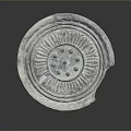 Ancient Circular Stoneware Household Item Featuring Decorative Radial Lines Dots And Chipped Edge