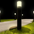Outdoor Pillar Lights Illuminating Night Pathway And Lush Green Grass Area