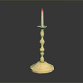 Golden Decorative Candlestick With Lit Candle And Shiny Reflective Base