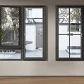 Modern Black Frame Casement Windows In Residential Home Exterior With Garden View