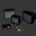 Three Vintage Black Monitors Of Various Sizes With Retro Electronic Accessories