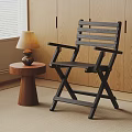 Modern Black Folding Wooden Lounge Chair With Side Table And Lamp In Indoor Area